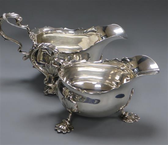 A pair of late Victorian silver sauceboats by Nathan & Hayes, Chester 1897/8, 21 oz.